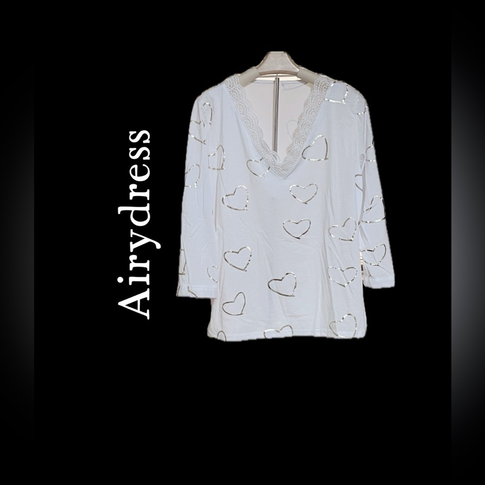 Airydress women’s pullover blouse with stamped martens hearts. Button sleeves.